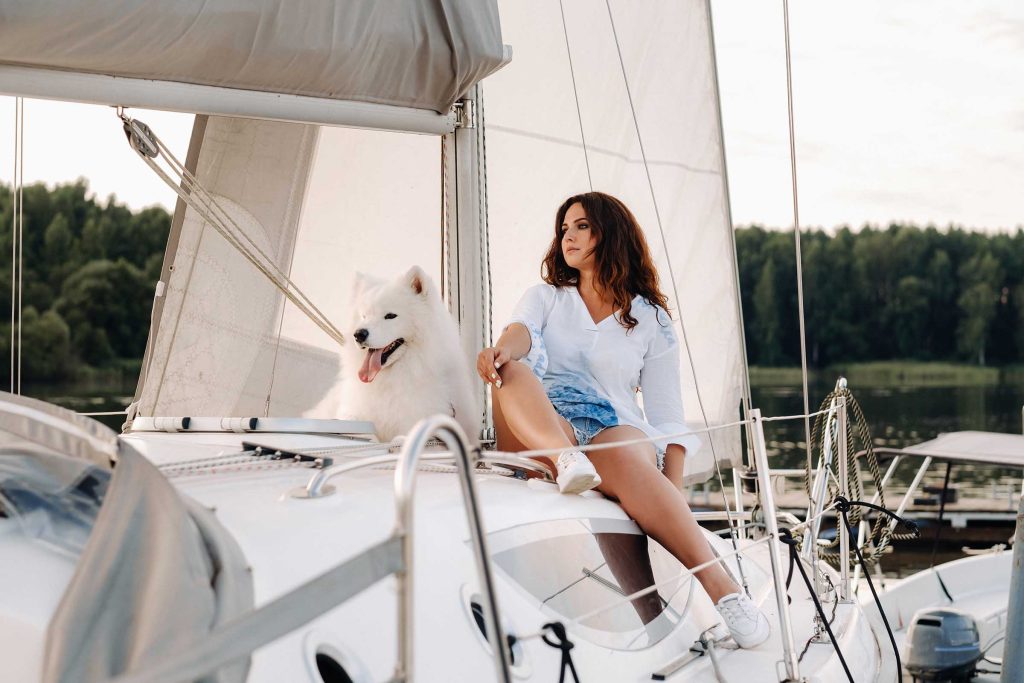 woman and dog yachting relax
