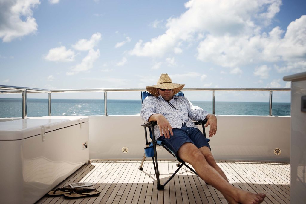 man relaxing on yacht